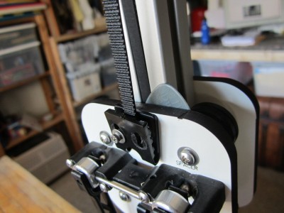 I found that a guitar pick is just the right width to fit in-between the column and the t-nut to help in screwing the belt clamps back on.