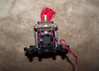 The empty holes you see are to support the optional 30mm fan for J-Head types.