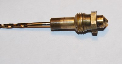 Used a small drill bit to push the Acetone soaked ABS thorugh the nozzle