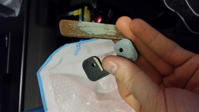 Shaving a bit off the spacer to get the extruder to sit flush.