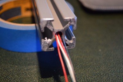 When threading the wires through the alluminum extrusions, I found it worked best to turn the alluminum in the opposite direction with one hand while feeding the wires with the other hand... this made the wires pull themselves through much easier.